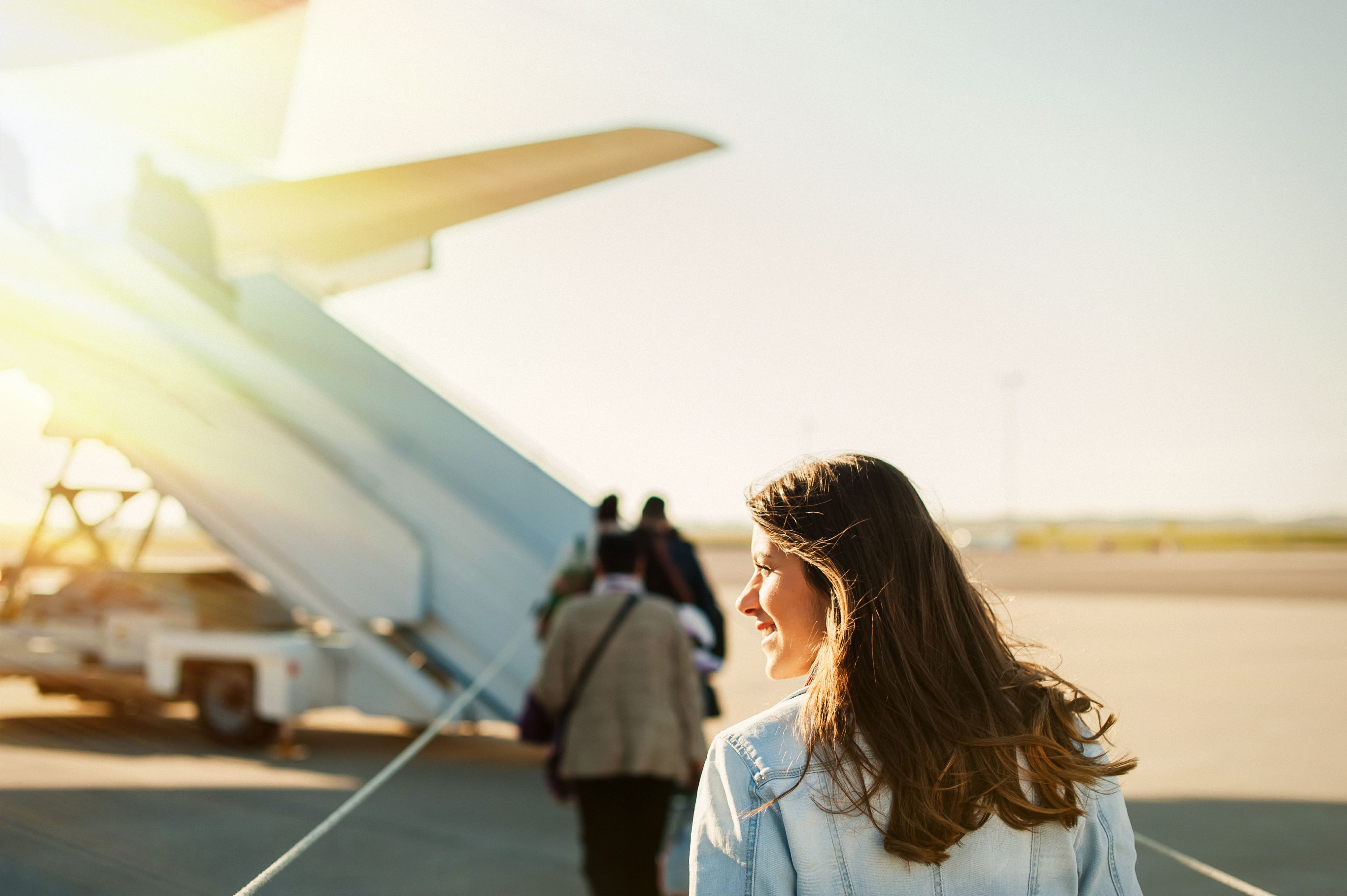 people boarding plane at airport