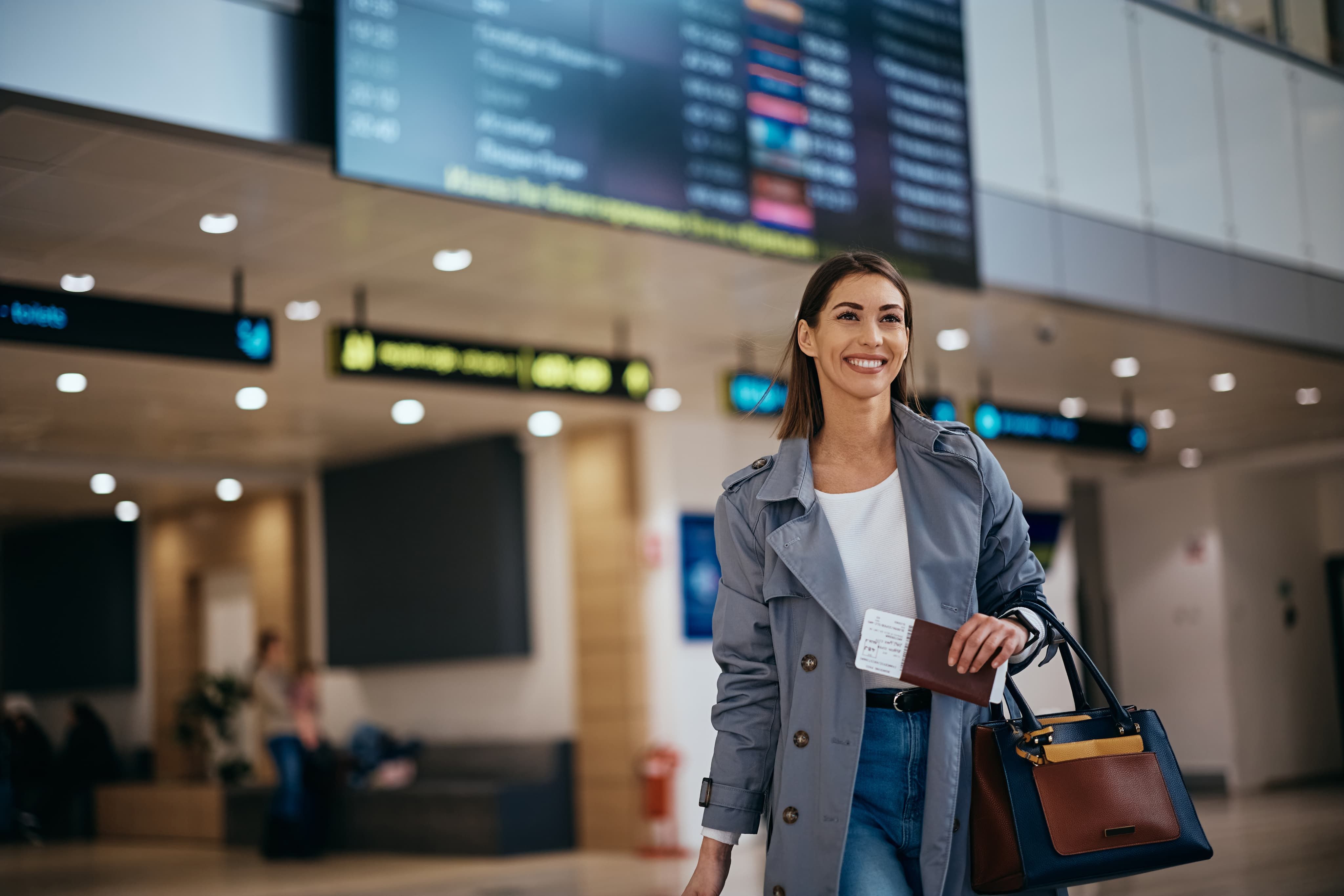 Woman smiling holding passport