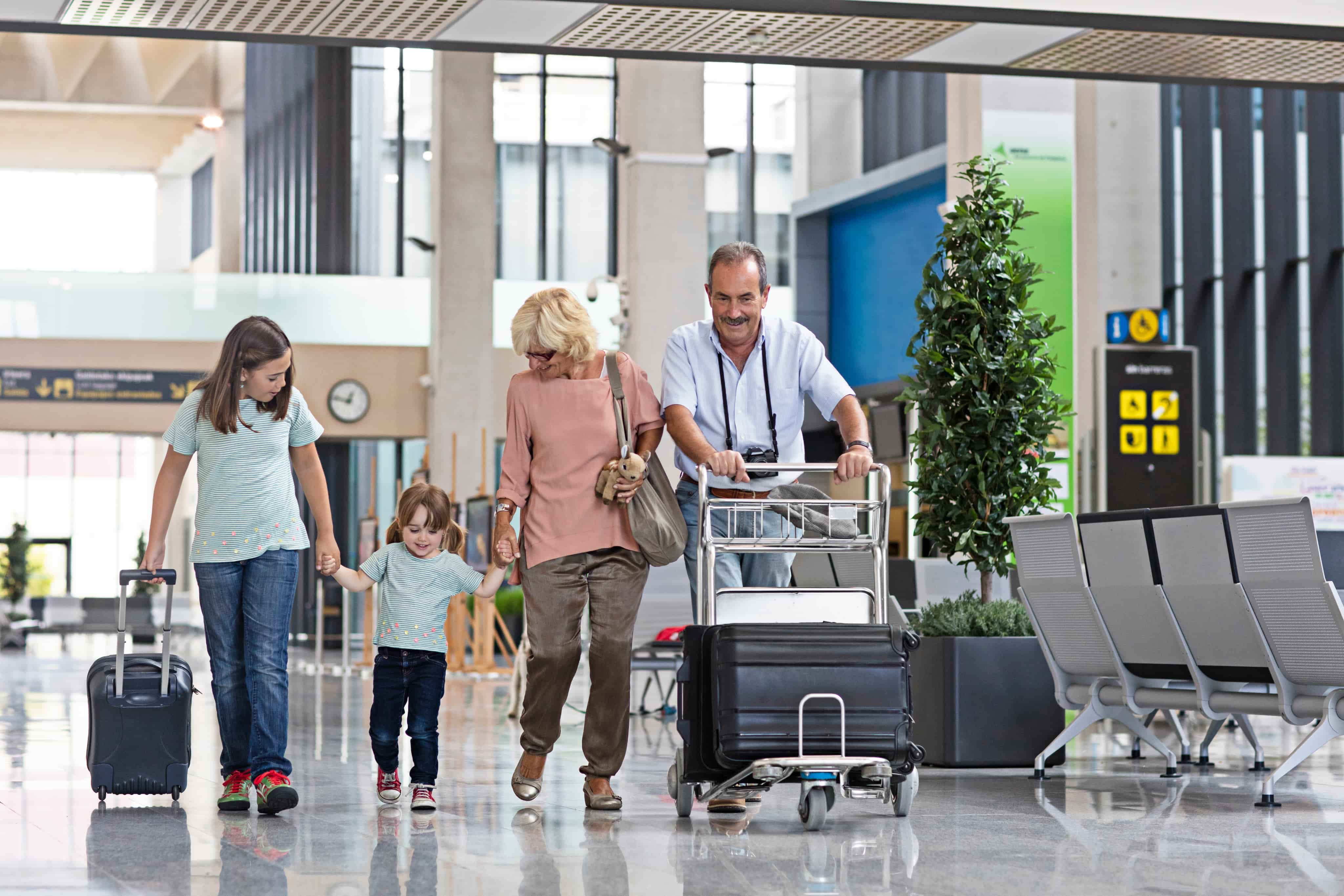 Family walking through airport