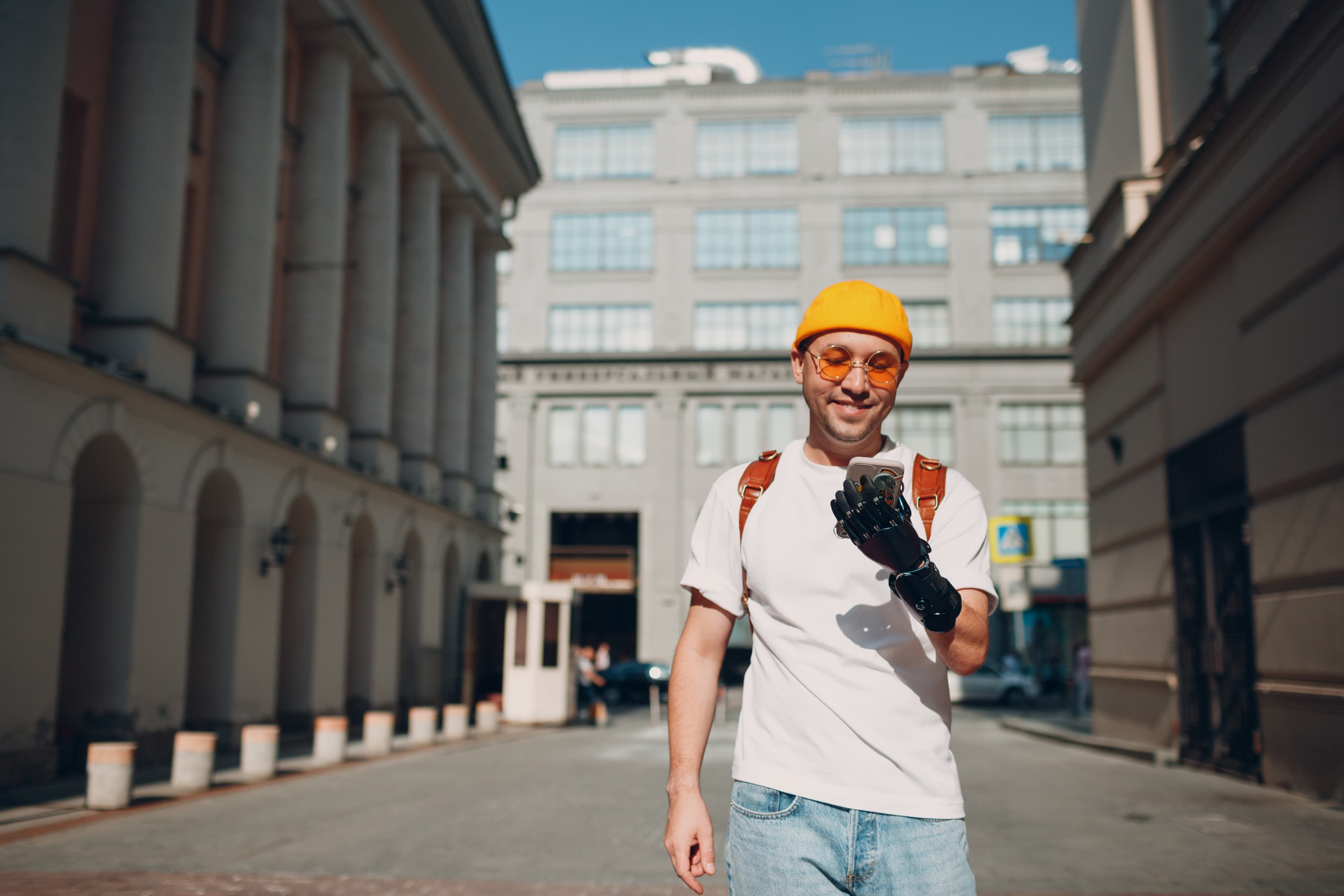Man smiling looking at phone