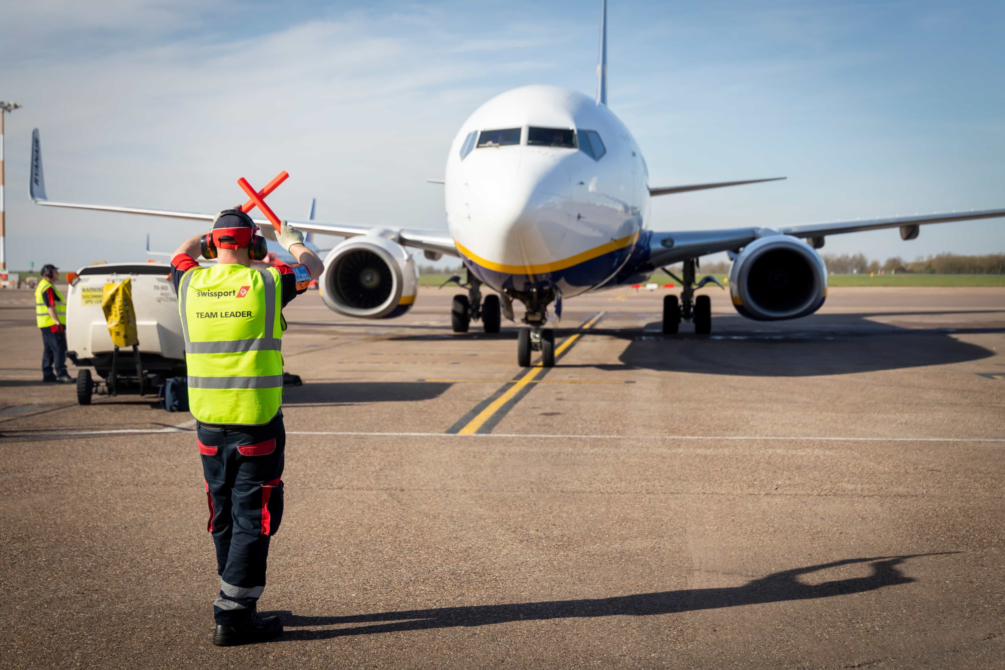Man signalling aircraft