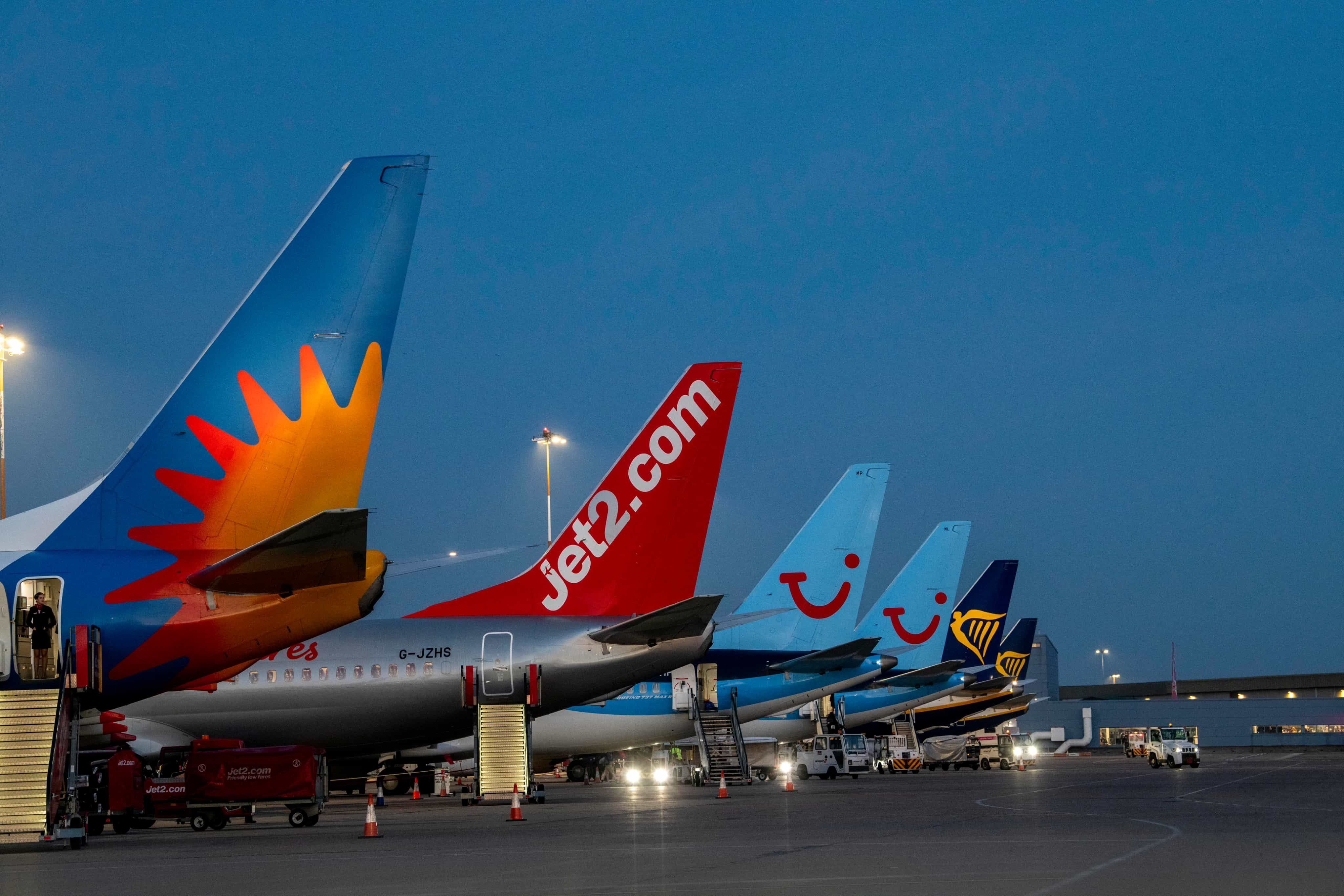 Plane tails lined up with different brand logos
