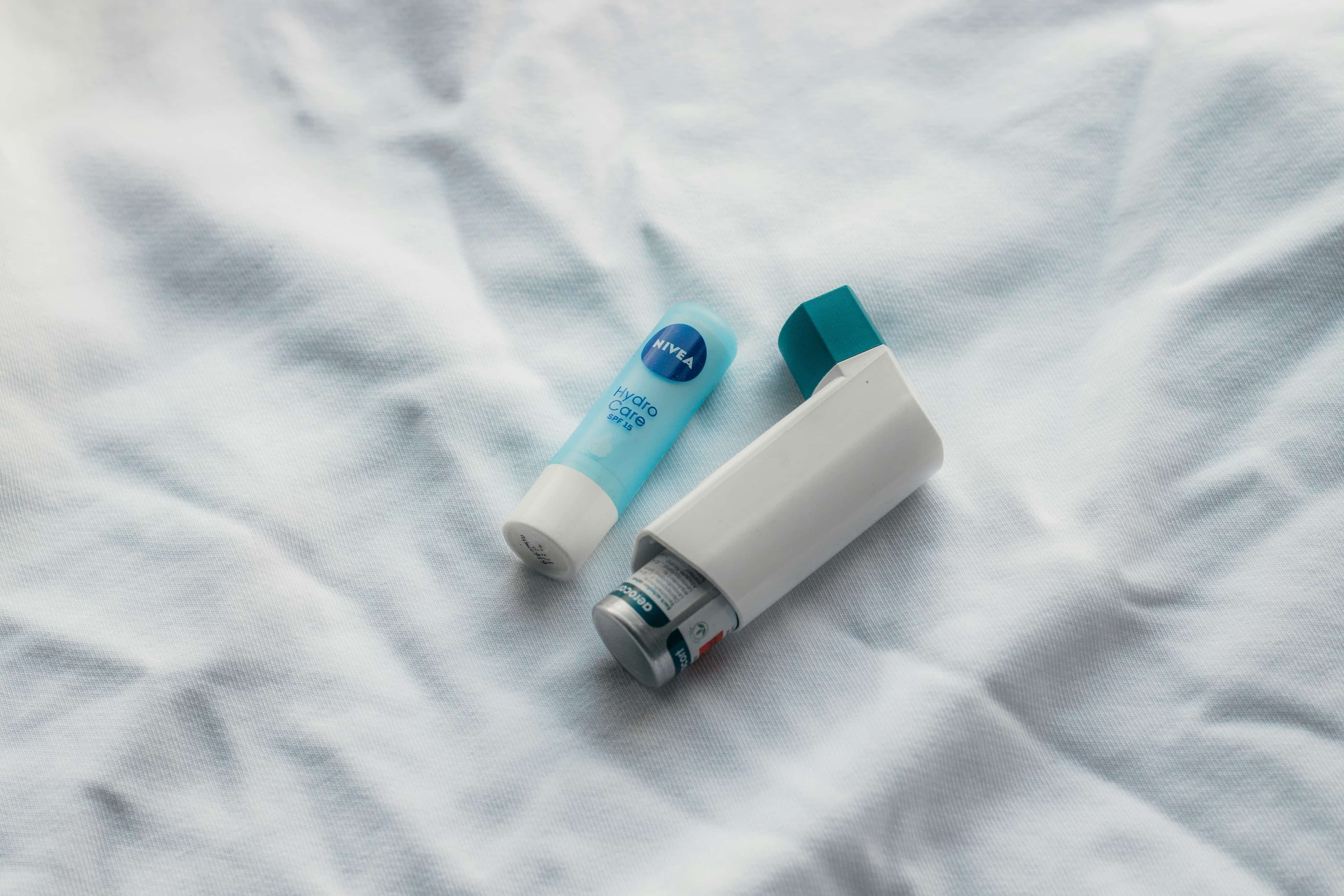 Lipbalm and inhaler on sheet
