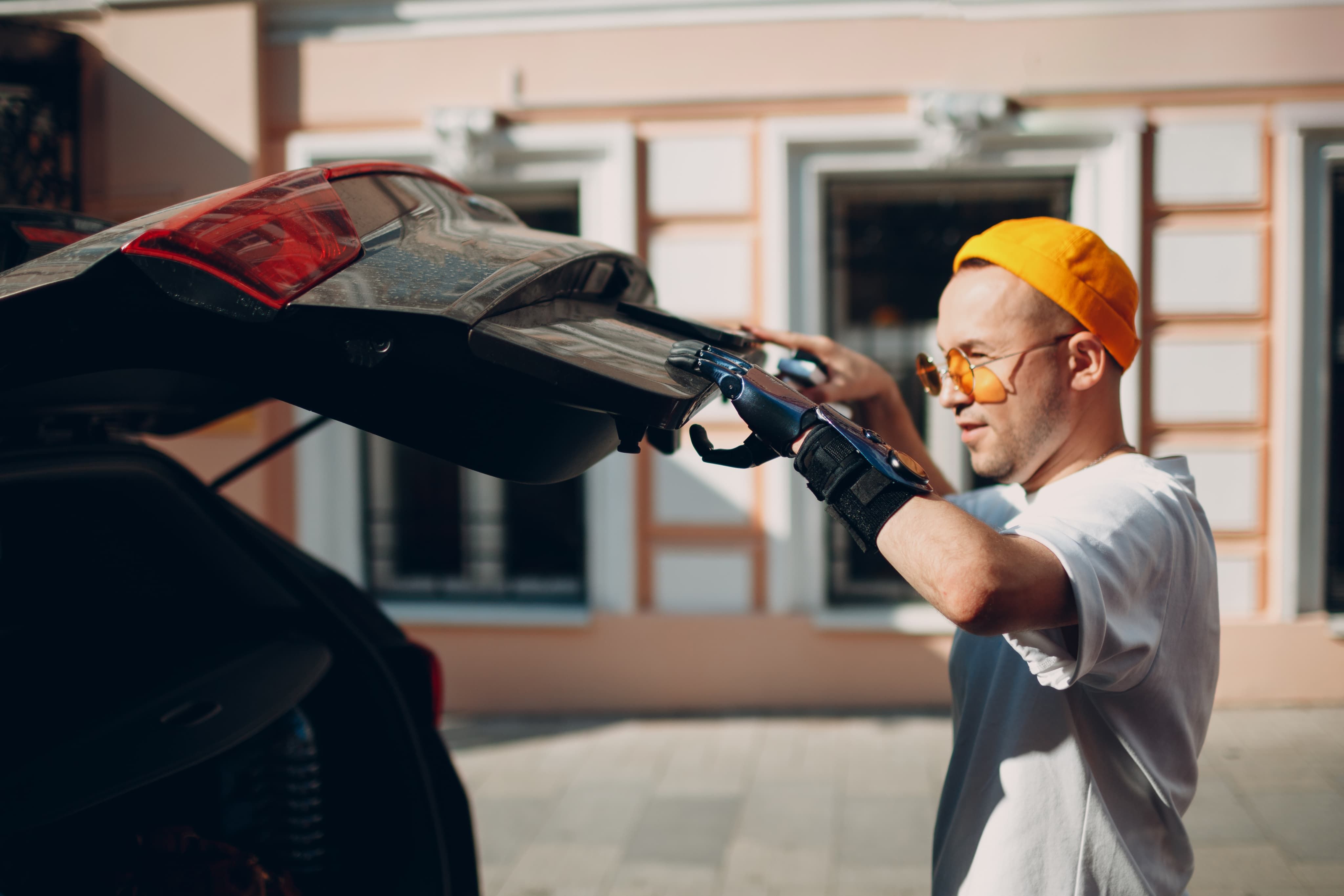 Man closing car boot