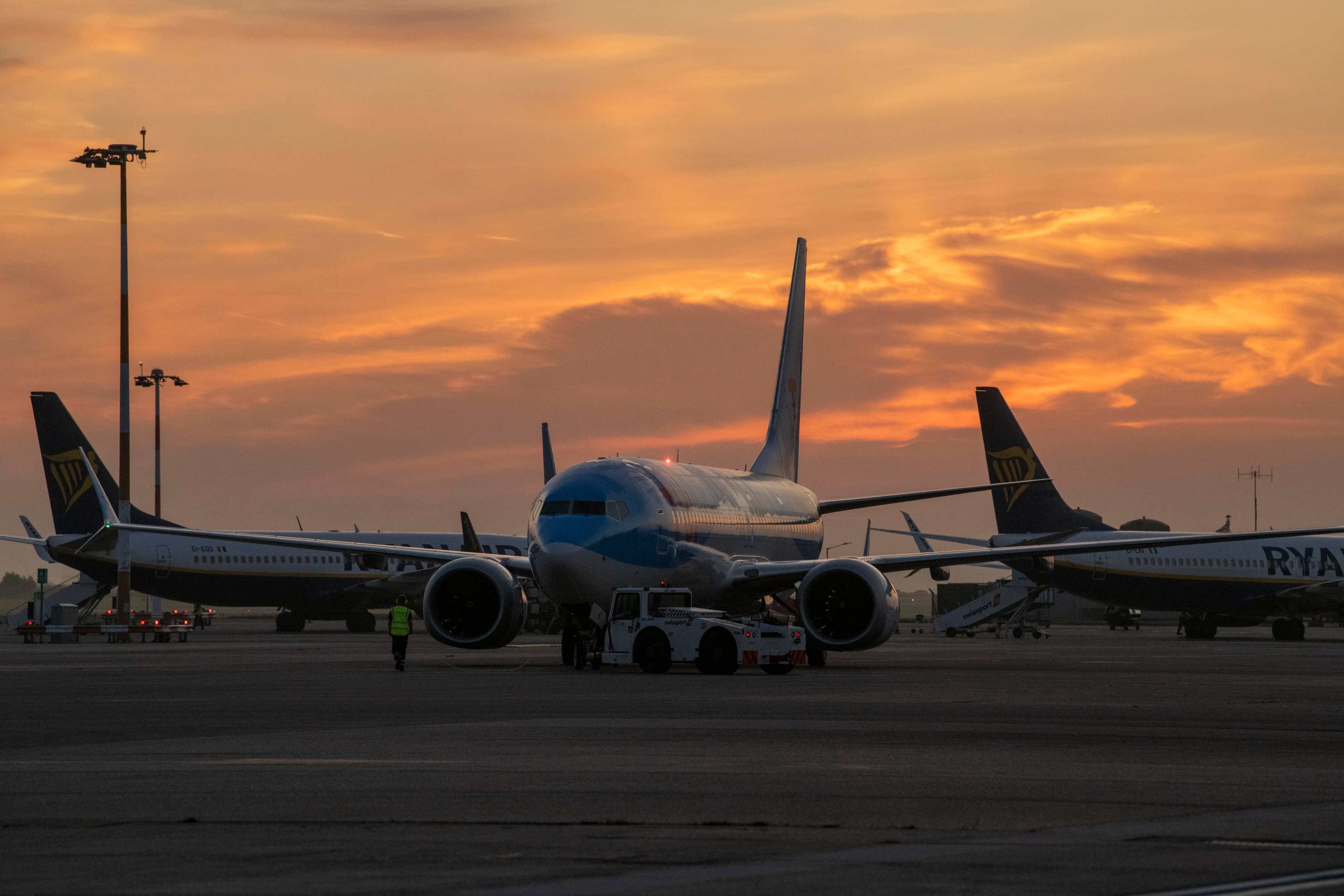 Sunset behind plane