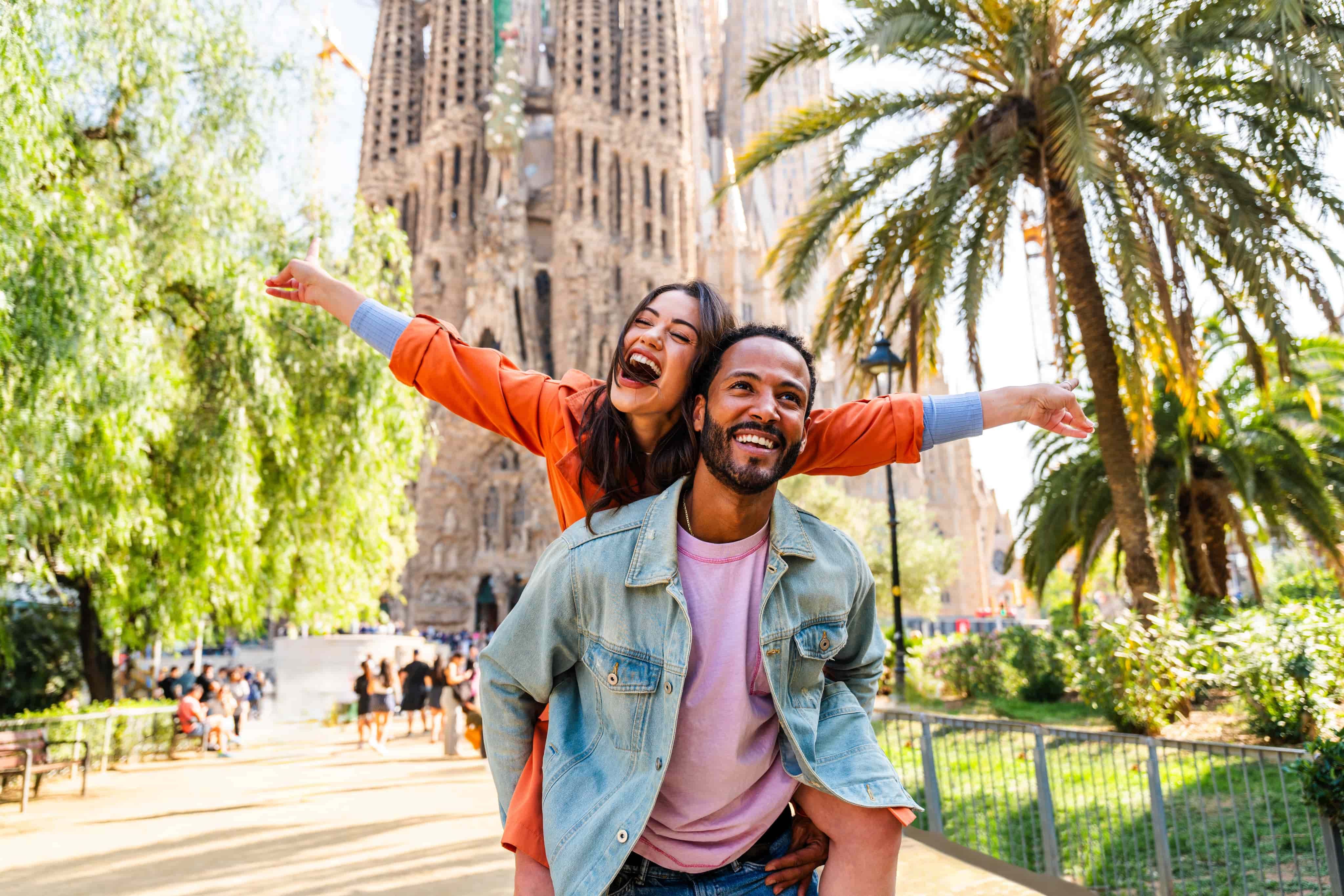 Man giving woman piggyback in Barcelona