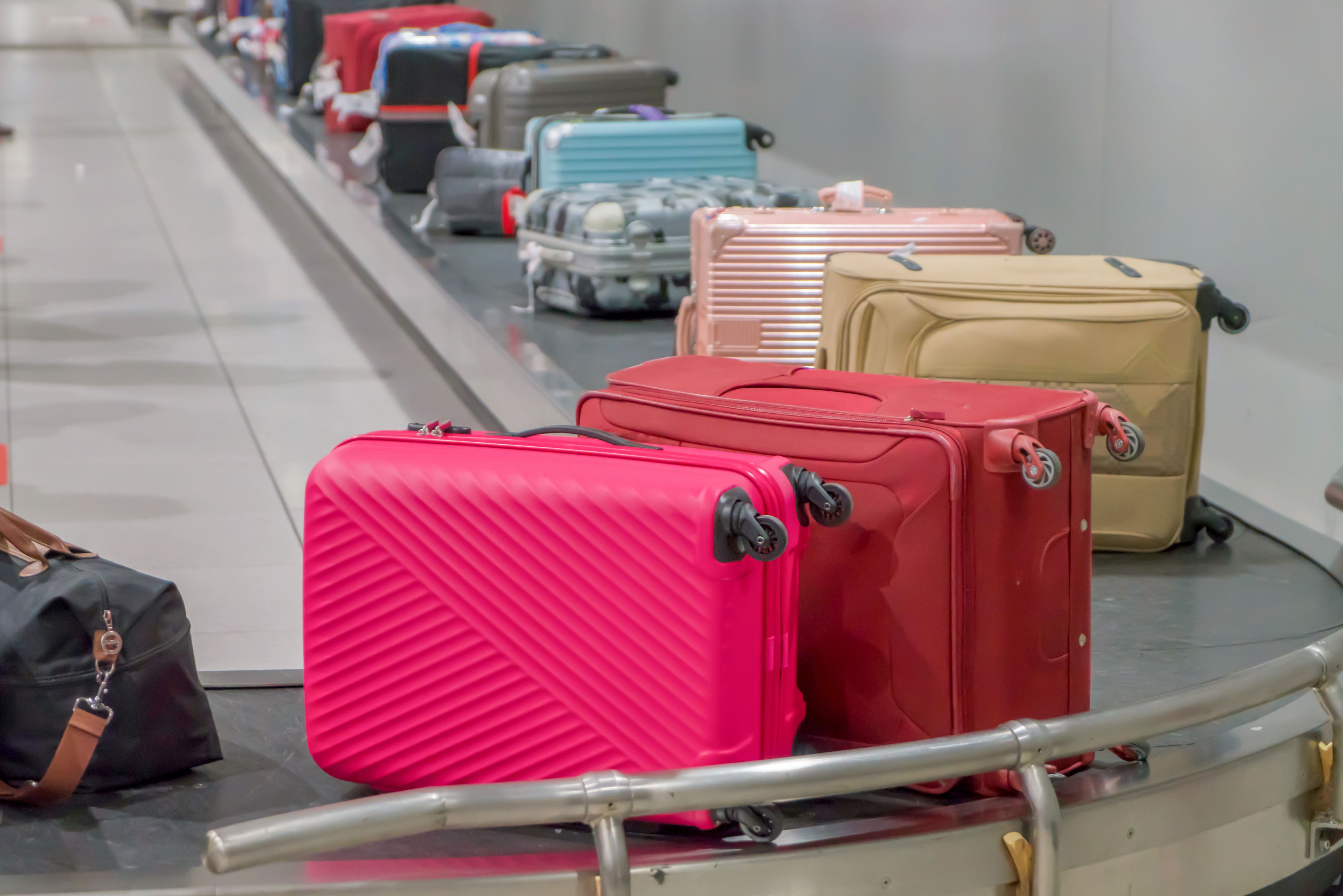 luggage on and airport conveyor belt