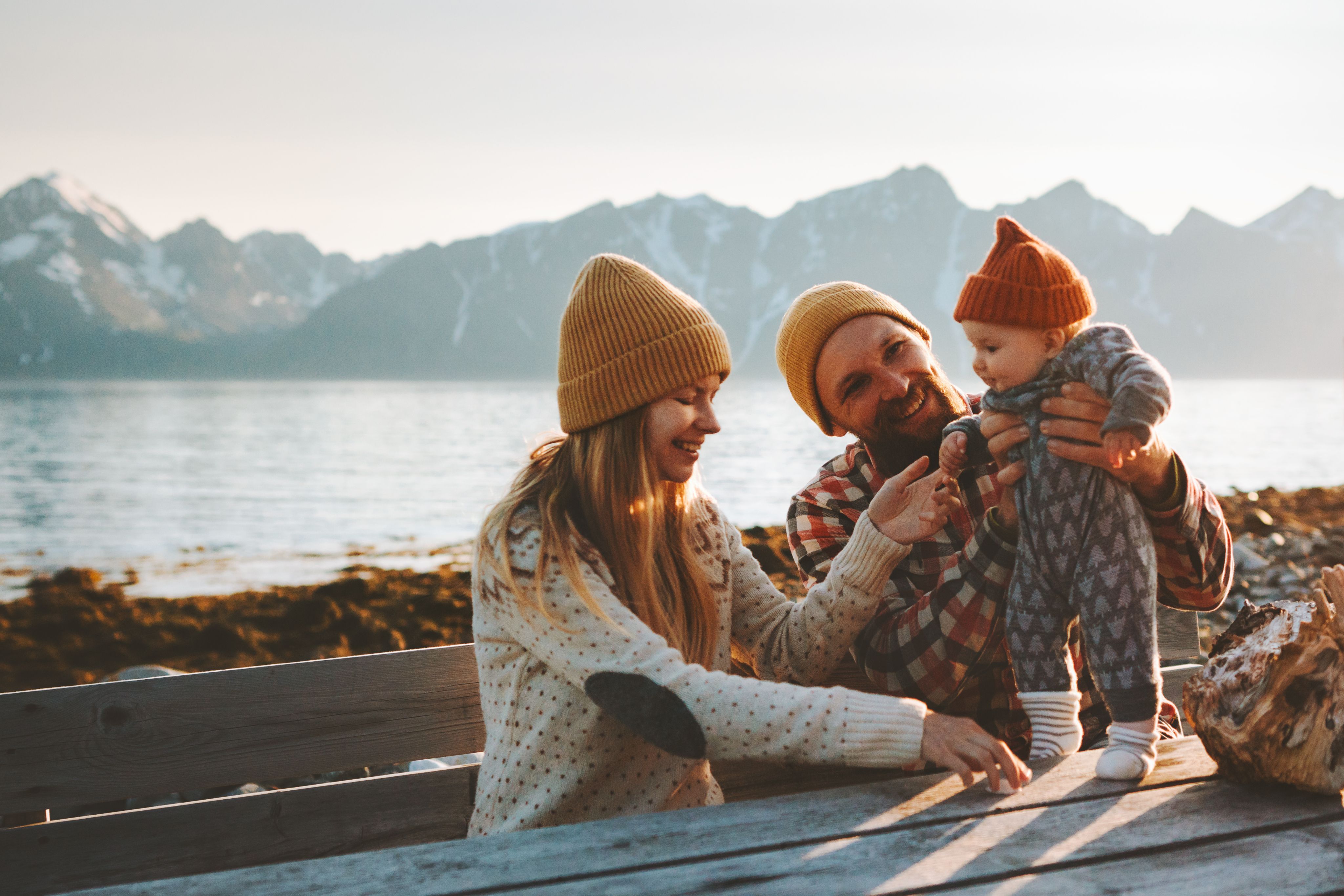family with child next to lake