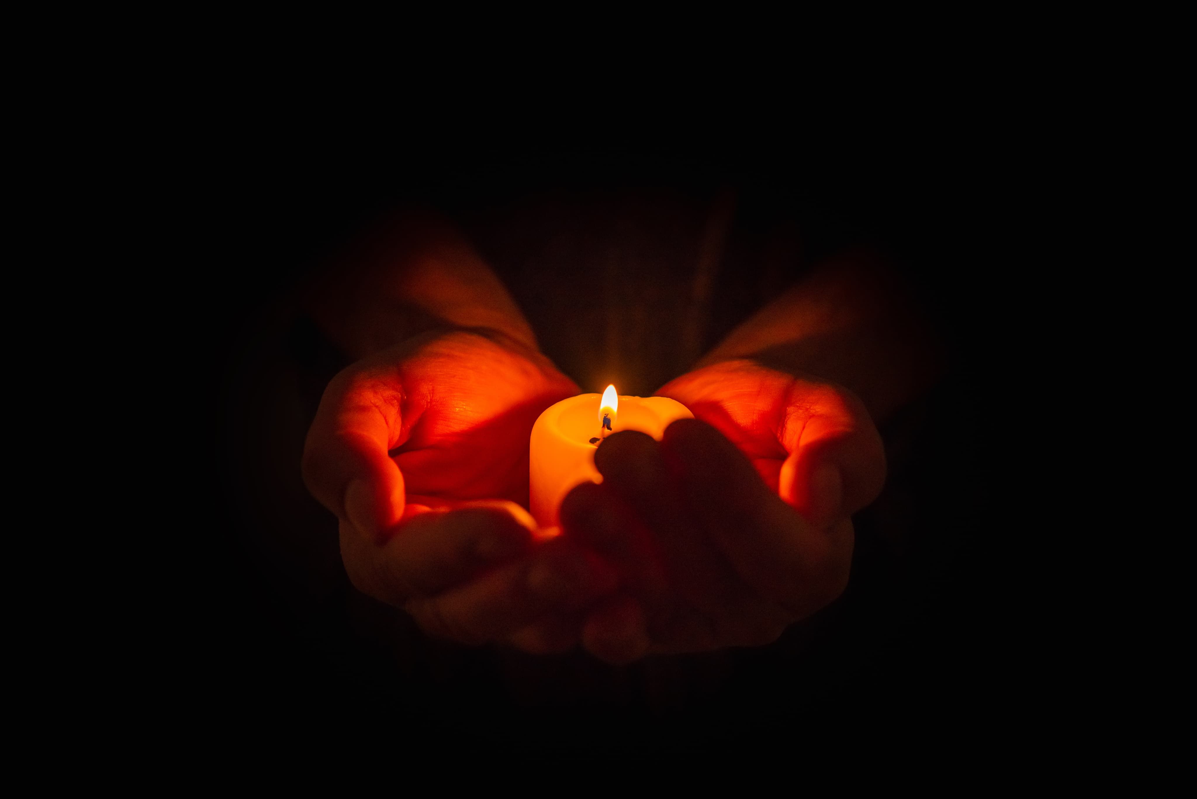 Holding candle in hands