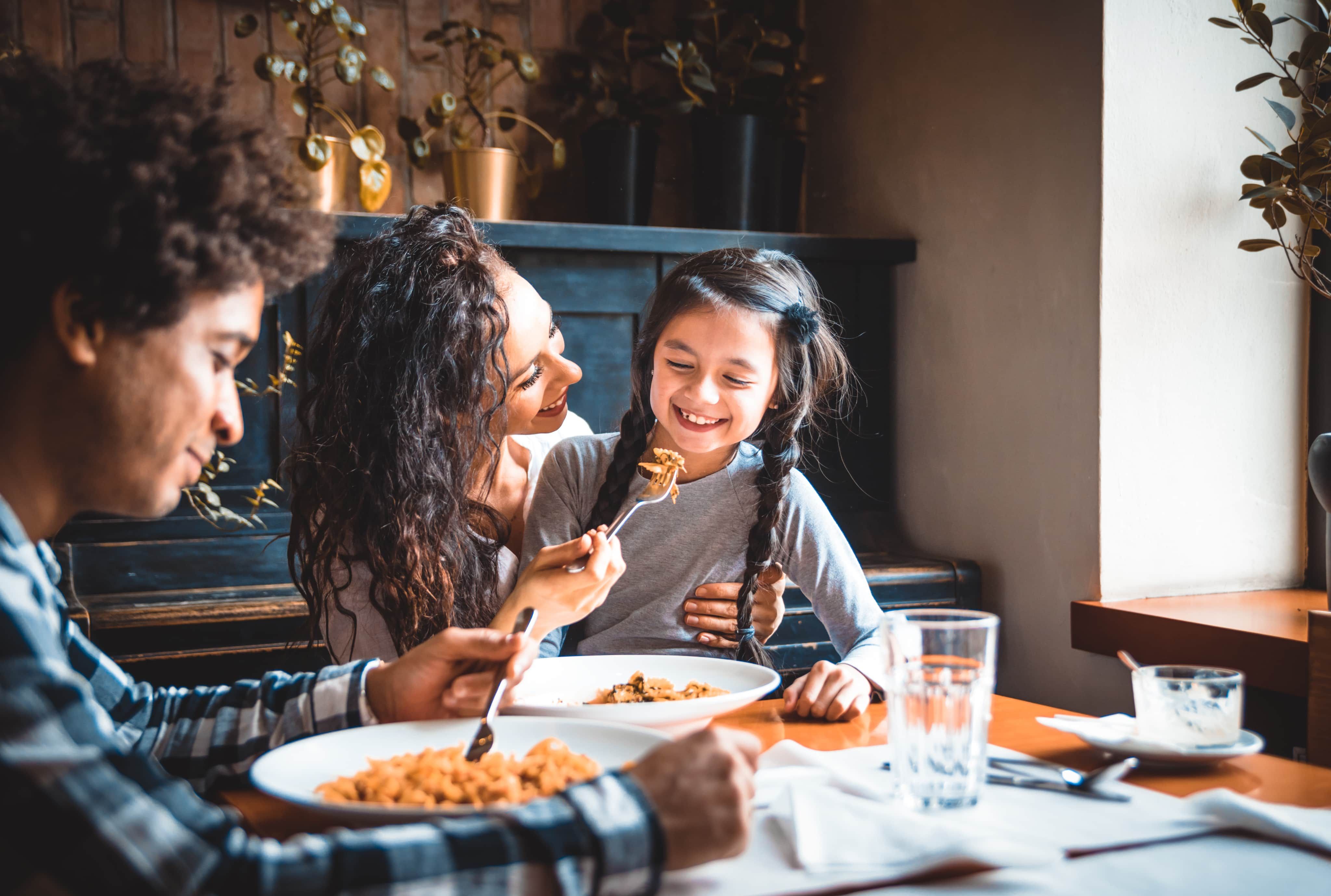 Family eating together and smiling