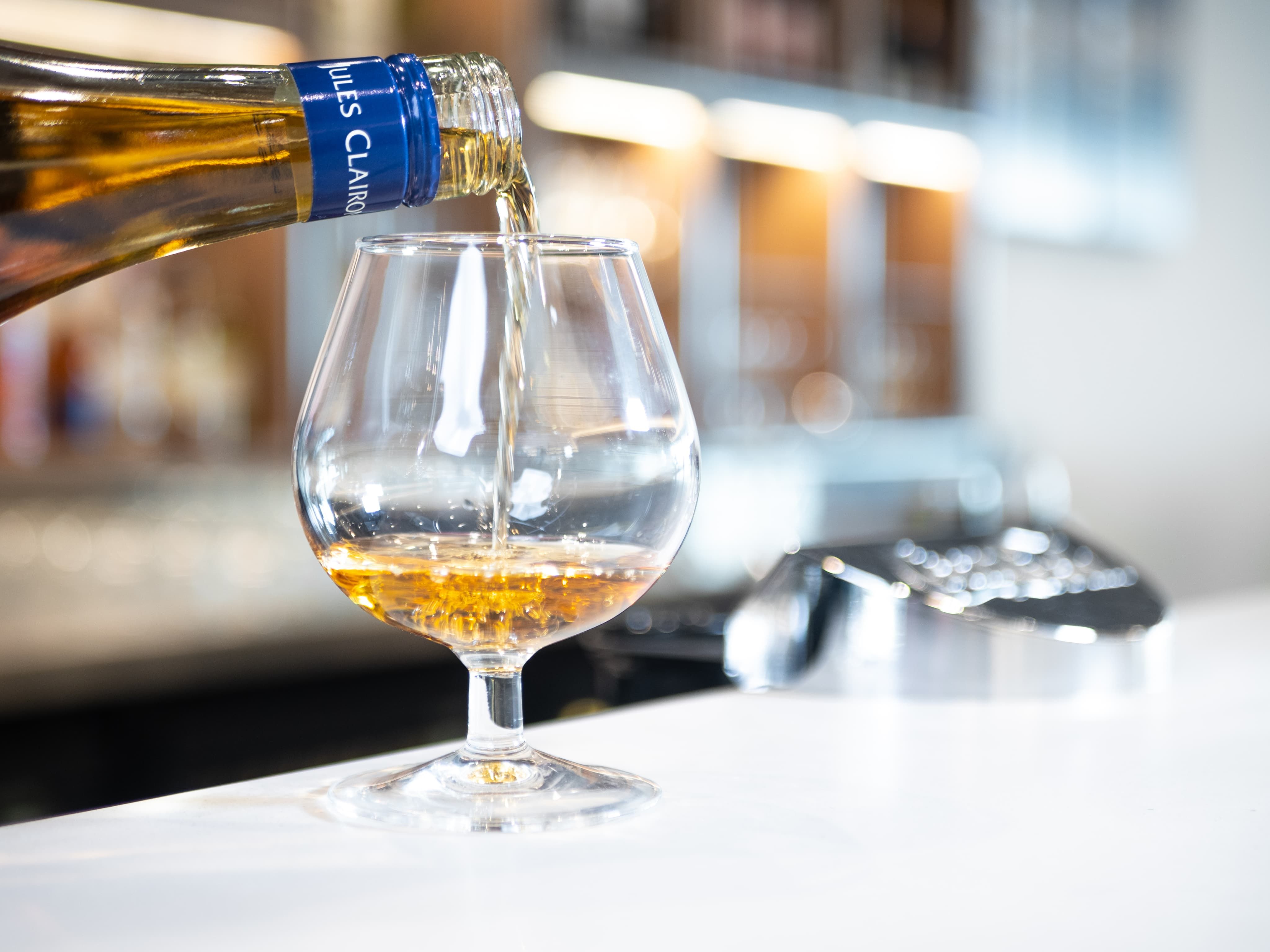 Pouring wine into wine glass