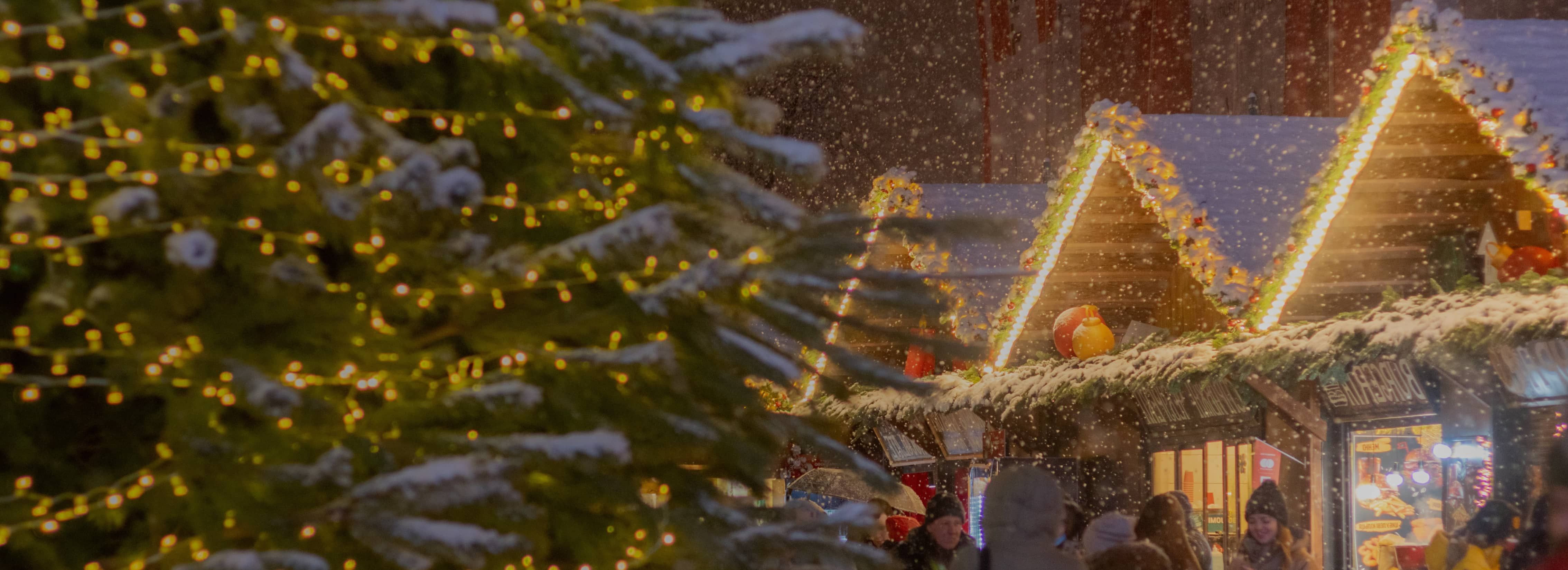 Image of wooden huts at Christmas market