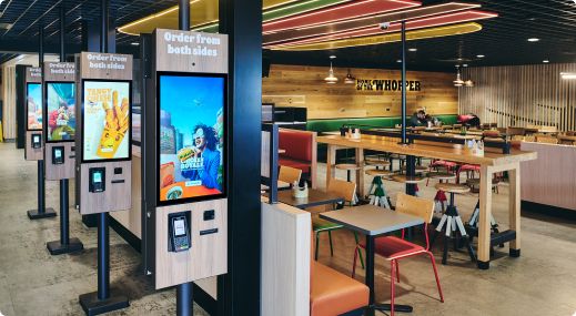 Ordering screens and seating area at Burger King