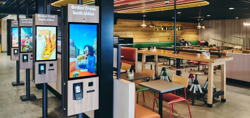 Ordering screens and seating area at Burger King
