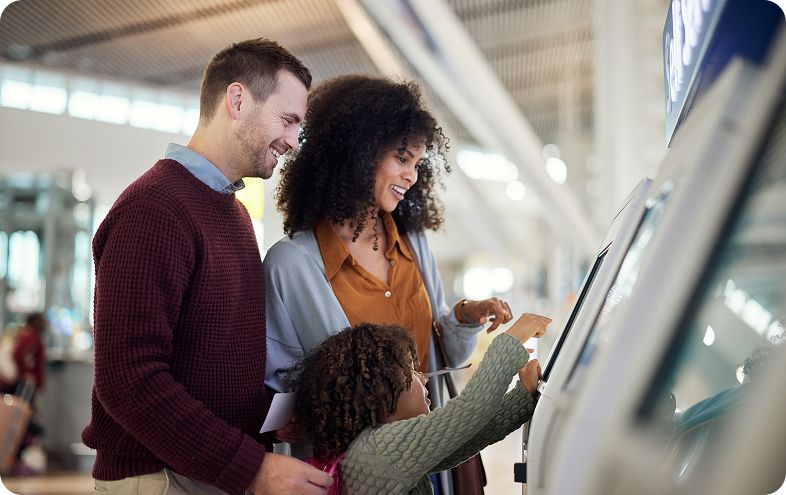 Family using touch screen kiosk