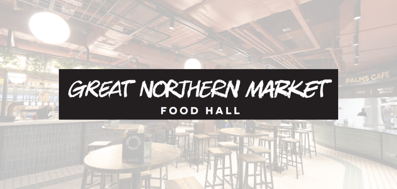 "Great Northern Market Food Hall sign over a stylish interior with round tables, stools, and modern décor."