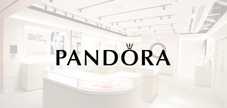 Pandora store interior featuring jewellery displays and posters, with large Pandora logo overlaying the image.