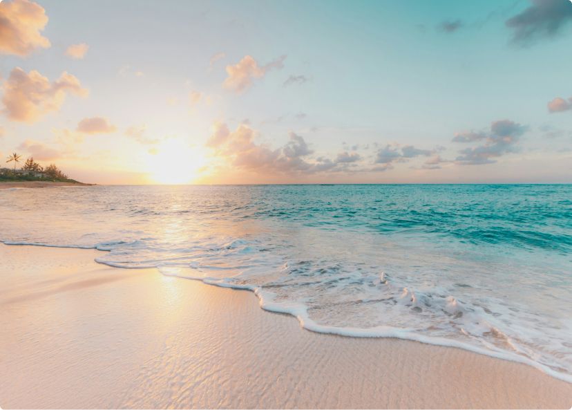 Beach with sunset in background